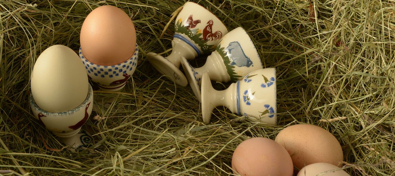 Fragrant hay, fresh eggs and egg cups